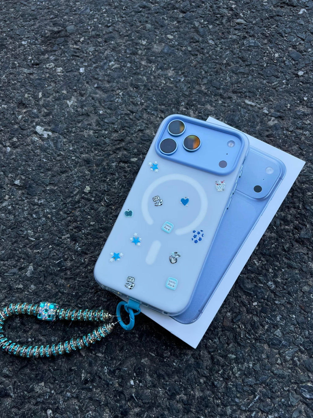 Blue star phone case in ice blue with beaded charm – main product photo
